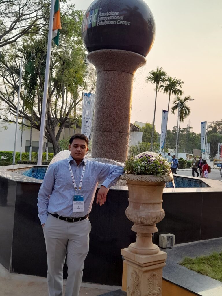 Abhijay stands in fron of the BIC centre fountain at the G20 India Energy week